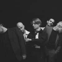 Ein schwarz-weiß Foto der Band Catastrophe & Cure